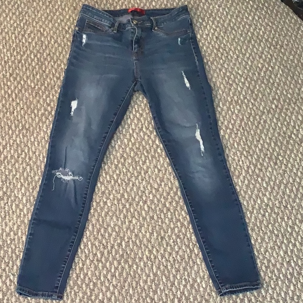 Dark blue jeans with rips